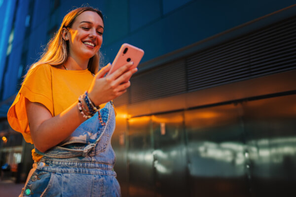 girl responding to social media on phone