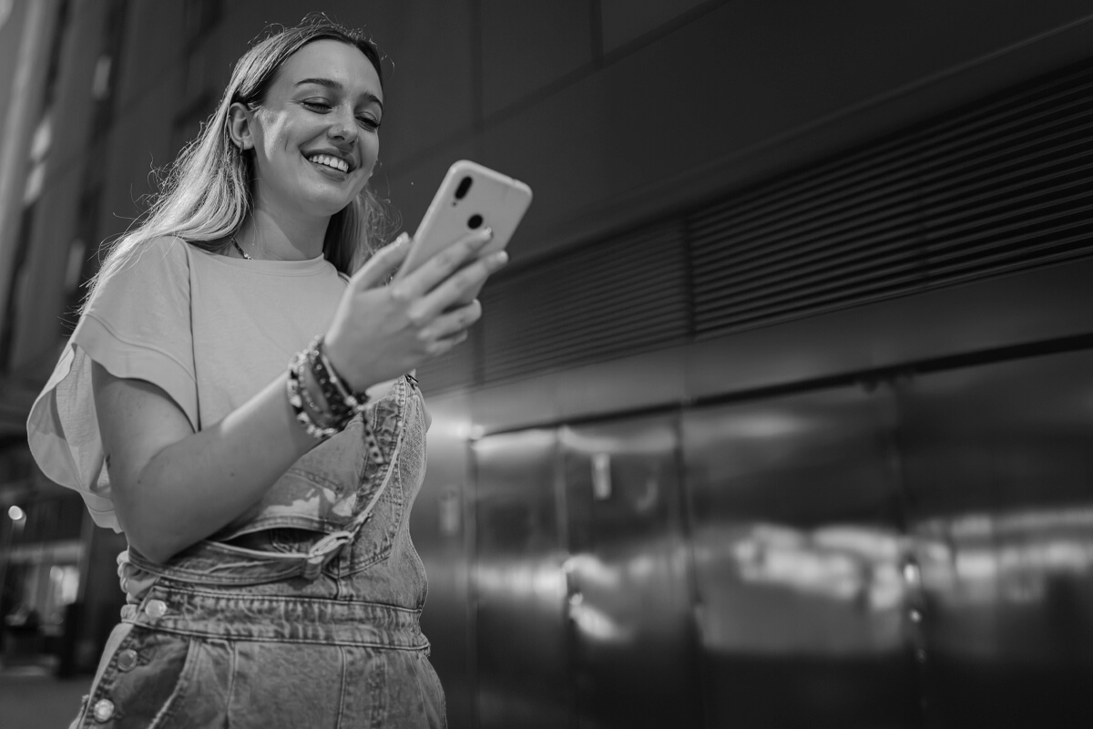 girl checking social media on phone